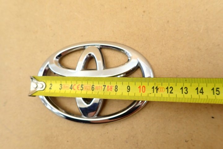 TOYOTA E12 01- ЛОГОТИП ЭМБЛЕМА КРЫШКА 110x75mm ЗАДНЯЯ 90975 OE, фото 7