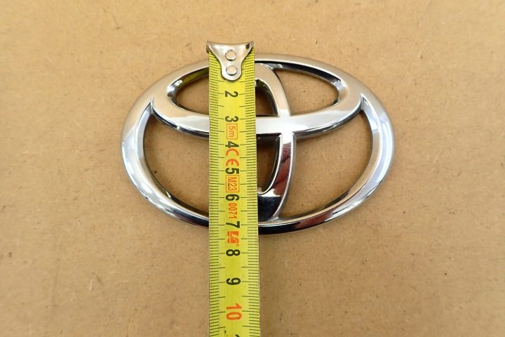 TOYOTA E12 01- ЛОГОТИП ЭМБЛЕМА КРЫШКА 110x75mm ЗАДНЯЯ 90975 OE, фото 8